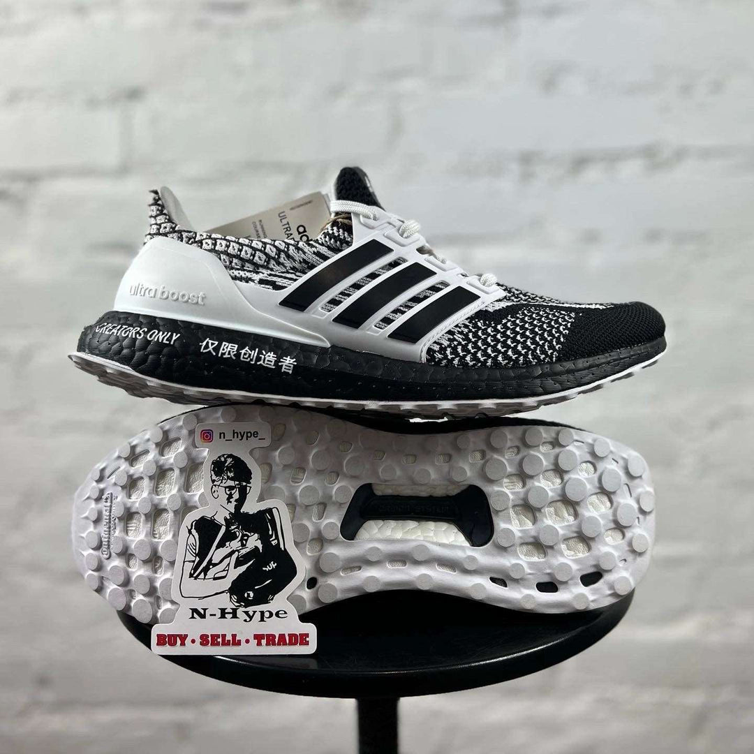 Buty Adidas Ultra Boost 5.0 DNA For Creators Only - wyjątkowy design dla kreatywnych dusz | Dynamiczne sneakersy na zdjęciu, prezentujące ich unikalną stylistykę i wysoką jakość wykonania | Doświadcz niezrównanego komfortu i wyrazistego stylu z Adidas Ultra Boost 5.0 DNA | Podkreśl swoją kreatywność z tymi niezwykłymi butami Adidas.