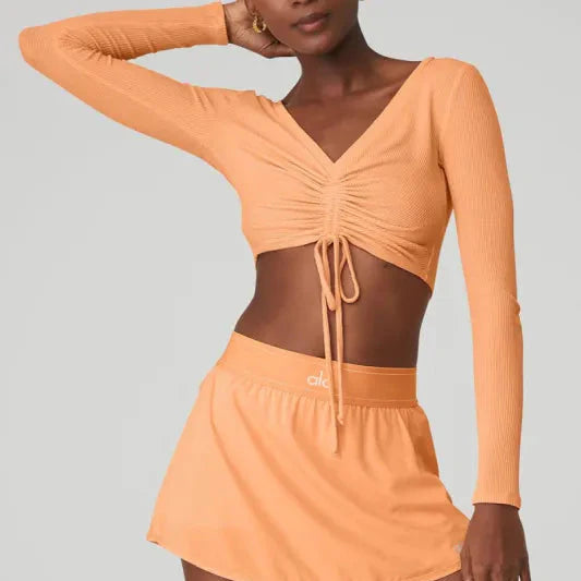 ALO YOGA Ribbed Cinch Cropped Long Sleeve Cantaloupe bluza damska N-Hype